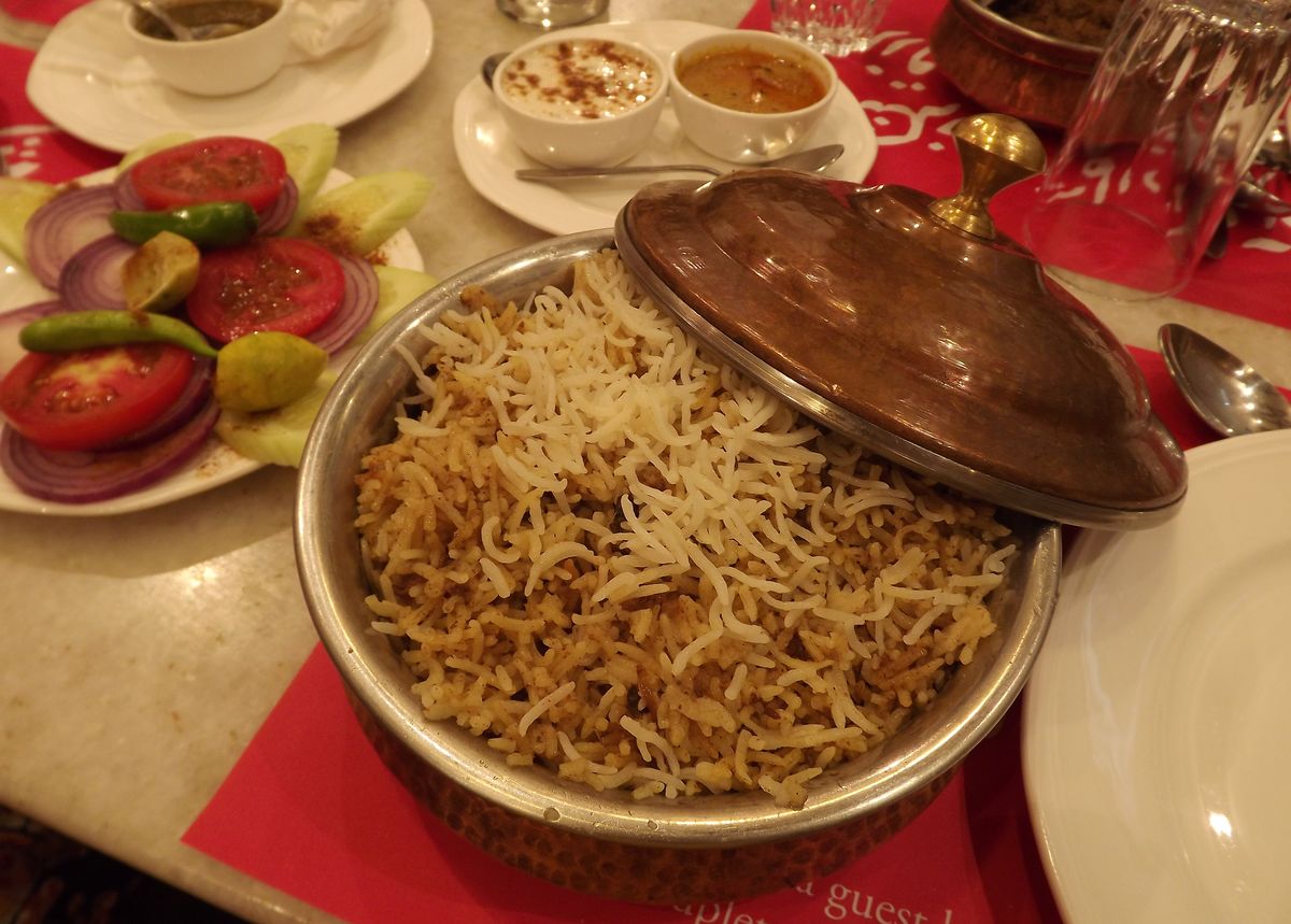 Saffron biryani served in a traditional handi pot