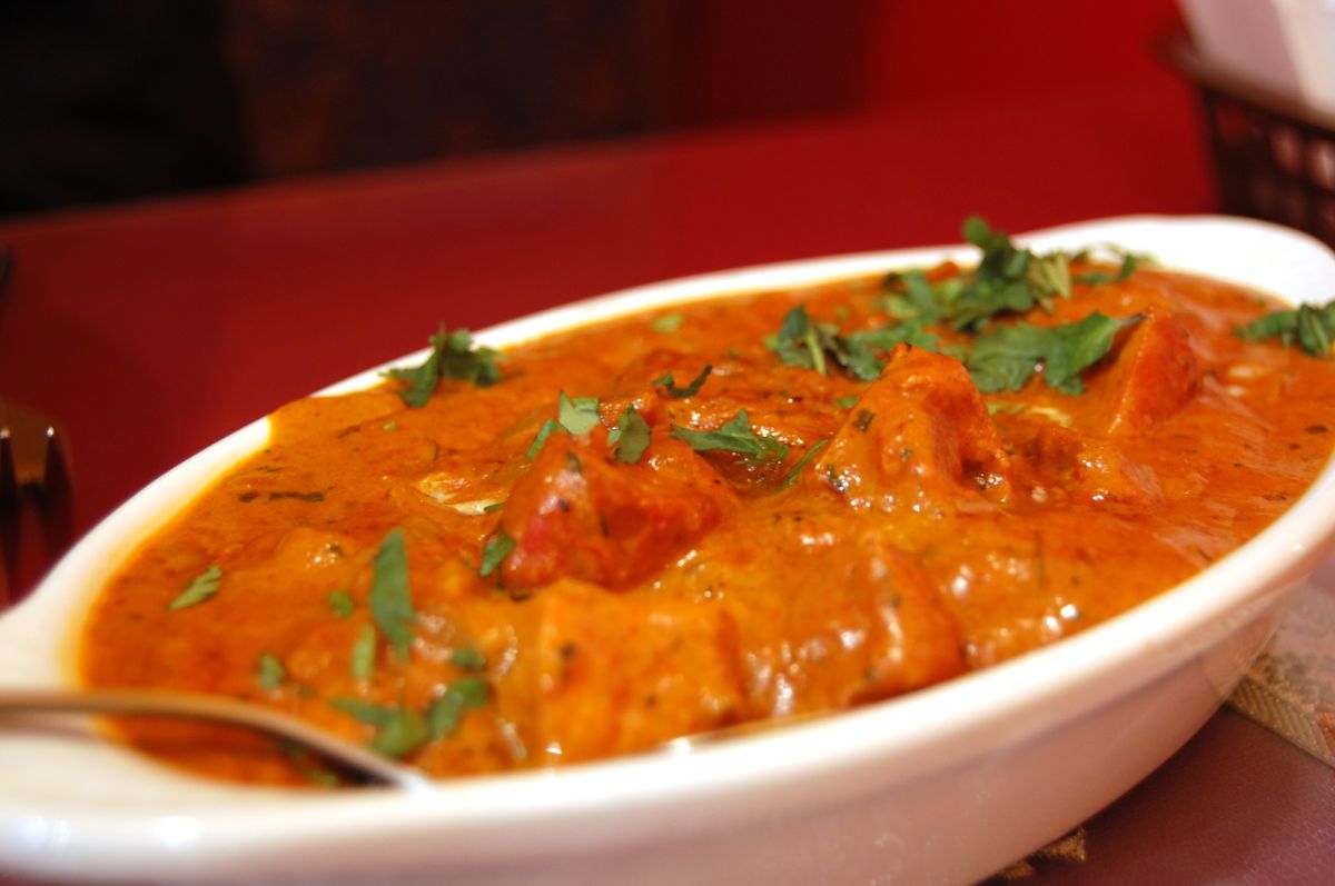 Elegantly plated Indian curry dish with garnish