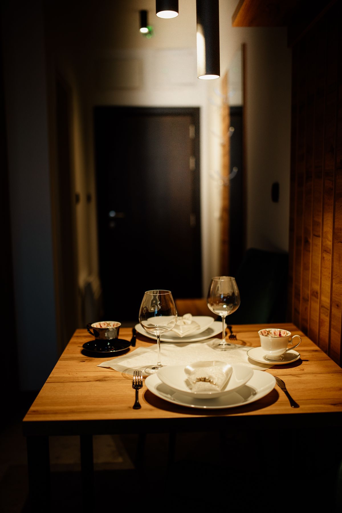 Cozy dining room with warm wooden interior and low lighting